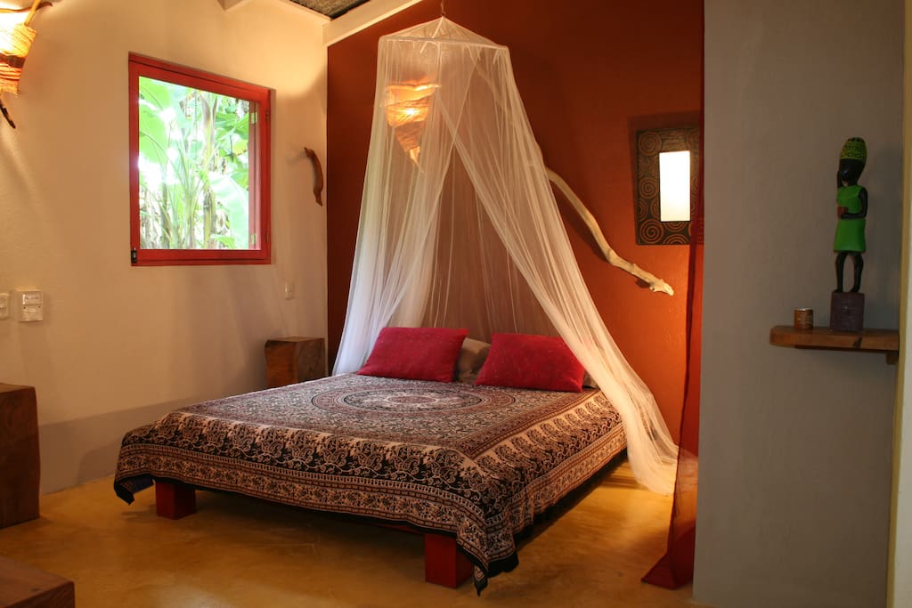 Queen bed with netting more for the tropical appearance than a necessity.