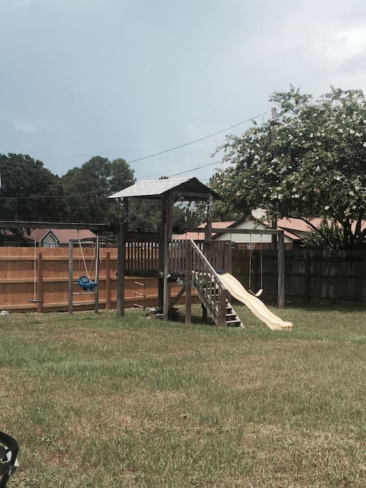 Playground located next to guest house in the backyard
