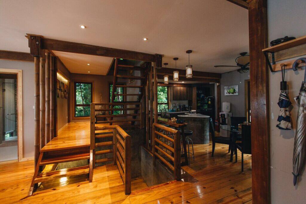 Entry way with 3 Levels of Custom Stairs made from locally reclaimed wood.