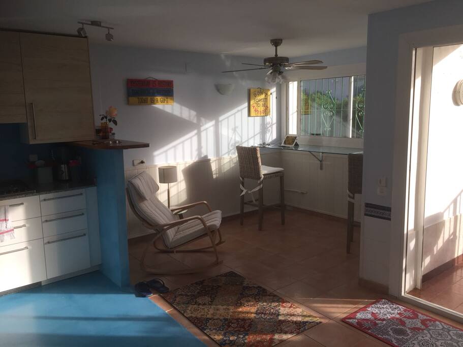living room and glass top dining table facing sea