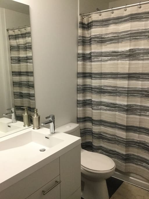 Spacious and connecting to the bedroom, this bathroom has everything you need with style