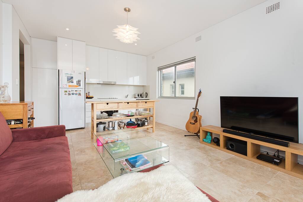 Open plan living area with balcony overlooking Bondi Beach
