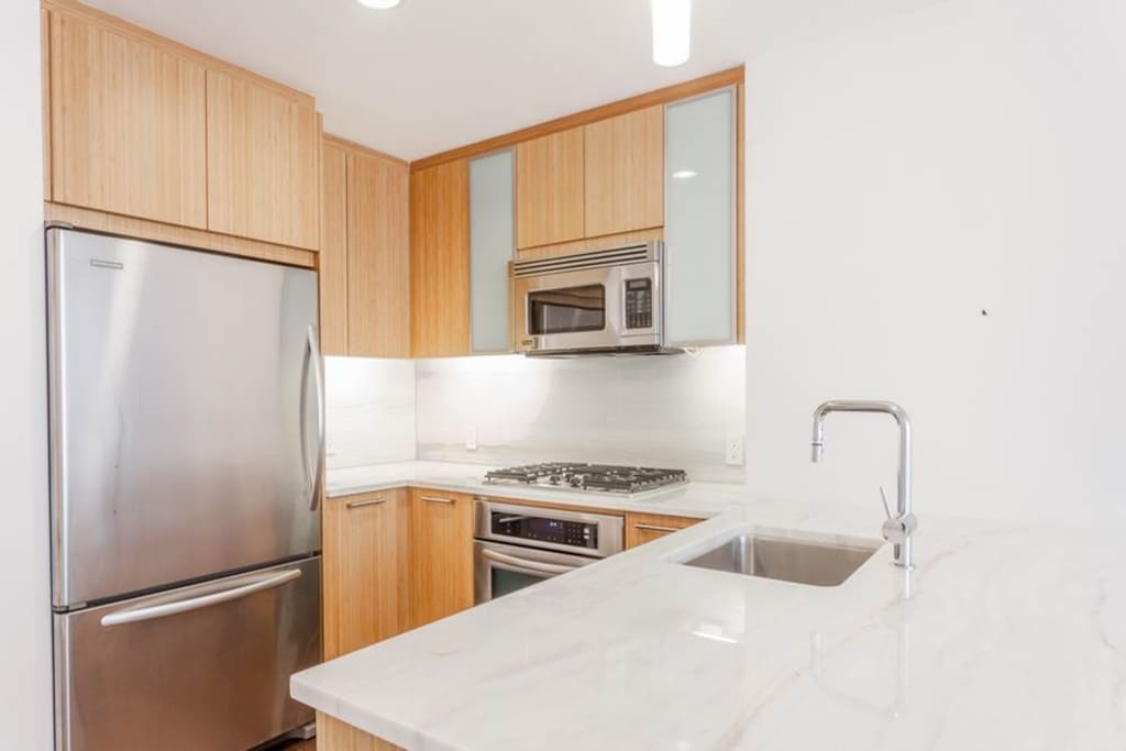 Fully outfitted kitchen with pots, pans, plates, silverware, toaster, Nespresso coffee machine, blender,
etc.