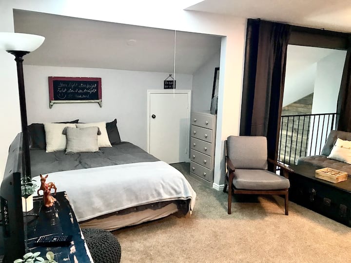 Loft queen bed and playroom door