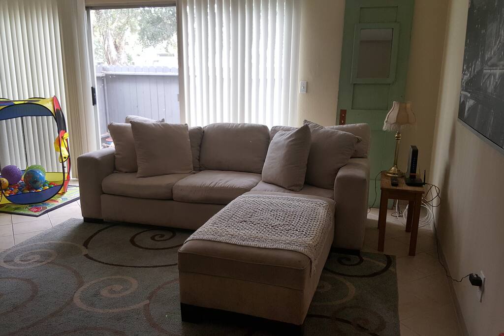 The ottoman has wheels and can be moved against the wall to serve as more seating