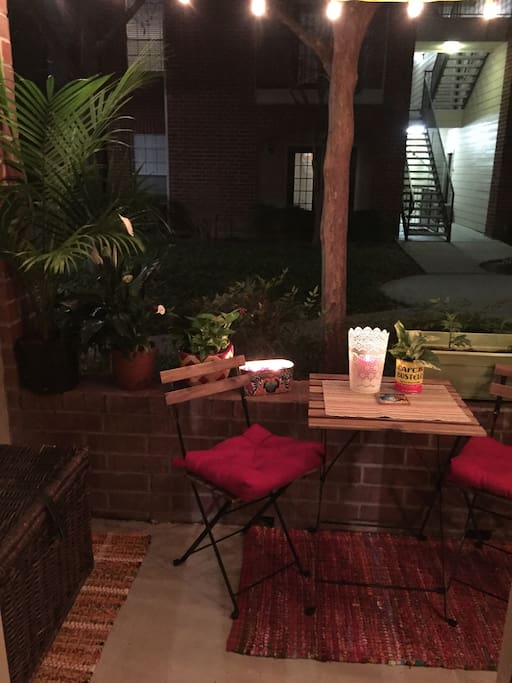 Outdoor patio area with small patio table and two chairs