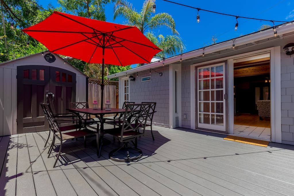 Great deck with table and six chairs, (cushions can be found in the entryway closet). Notice the strand of lights which make their way around the entire deck.