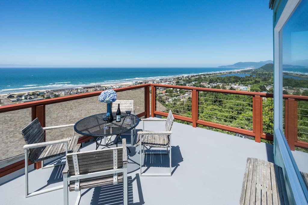 Upper balcony for dining alfresco while enjoying the incredible 180 degree view.