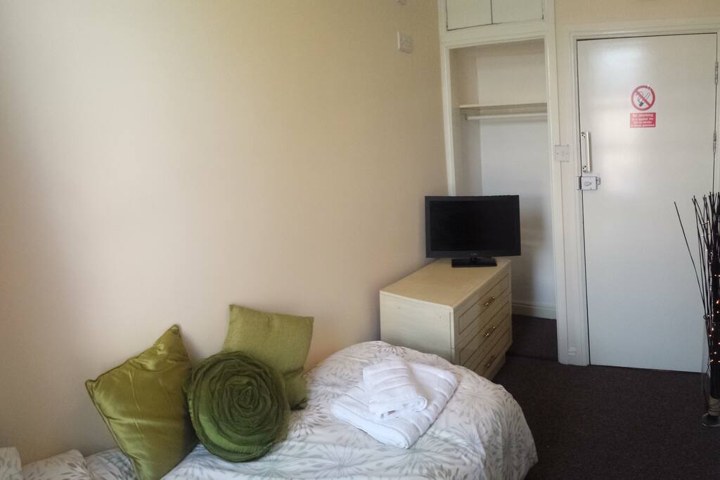 There is a small wardrobe and chest of drawers