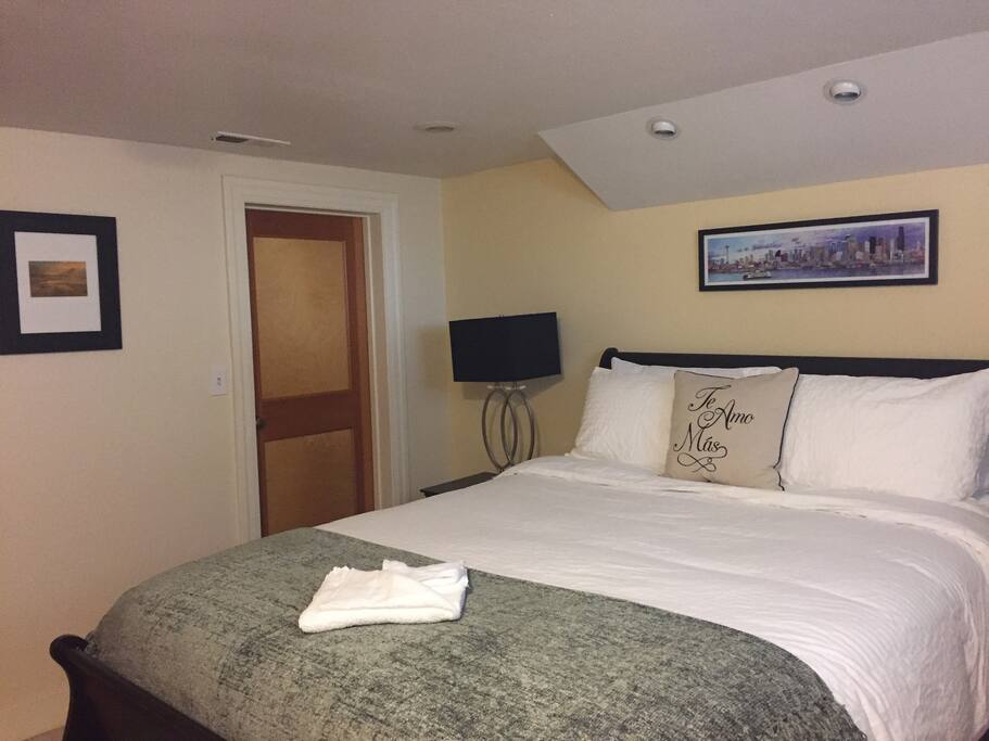Same Queen sized bed with different sheets and New Art work.