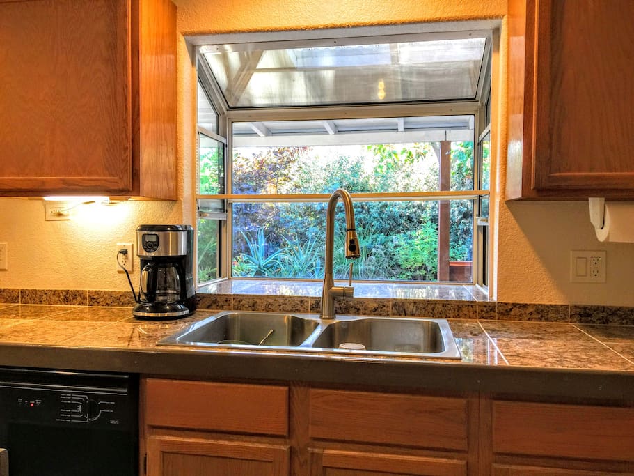 View from the sink and the coffee maker comes with coffee at your connivence
