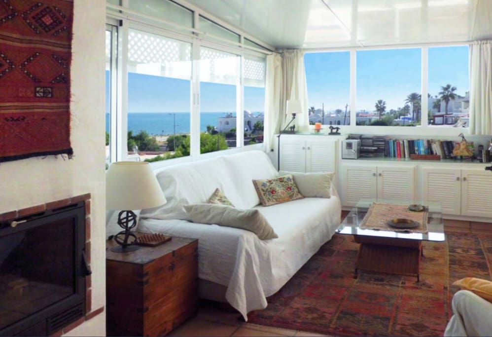 Open living room with sea & mountain views