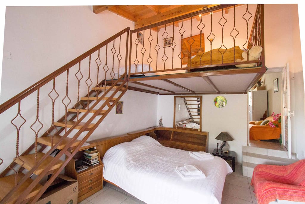 There is a master bedroom for two people plus an attic with two more single beds