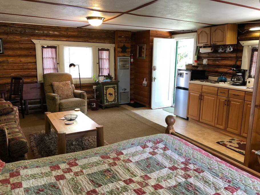 Recliner, kitchenette, fridge, foldout full-size couch.