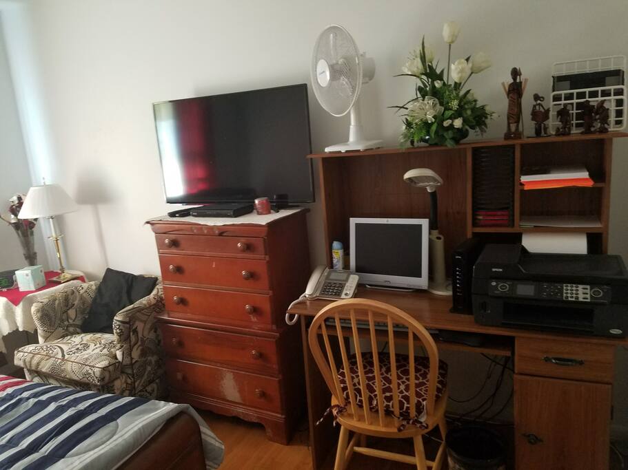 Night Table with Alarm Clock, Fan and Light. Desk with Computer and Printer Access.