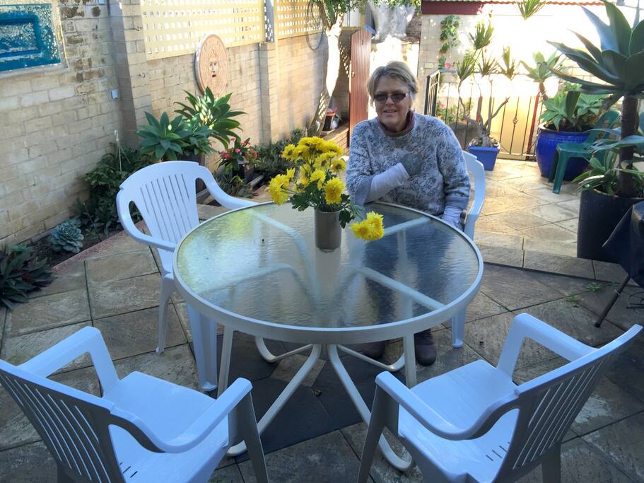 Lovely outdoor space with pleasant garden and outdoor table and chairs