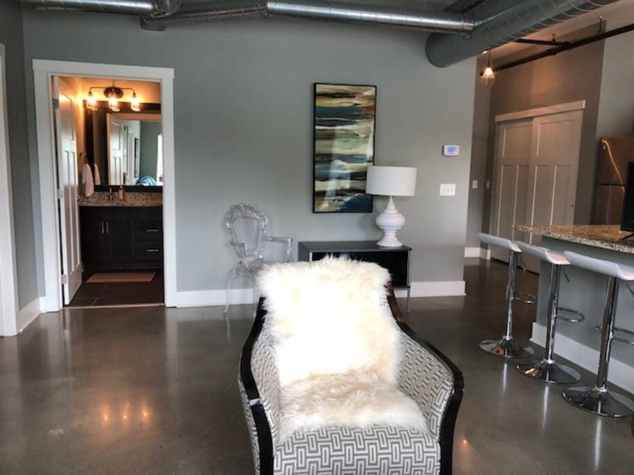 Living Room and bar stools at granite counter top! I love this space wide open, light filled, and spacious.