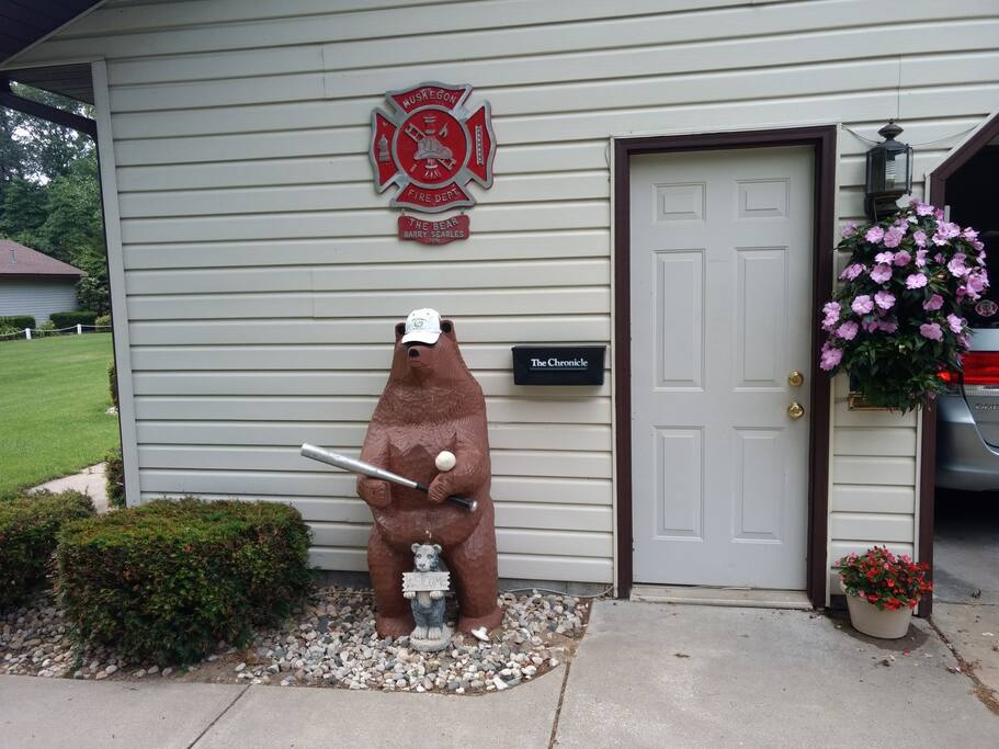 The "BEAR" waiting to welcome our guests to his "DEN". The bat points to the way his guests need to go to get to the deck.