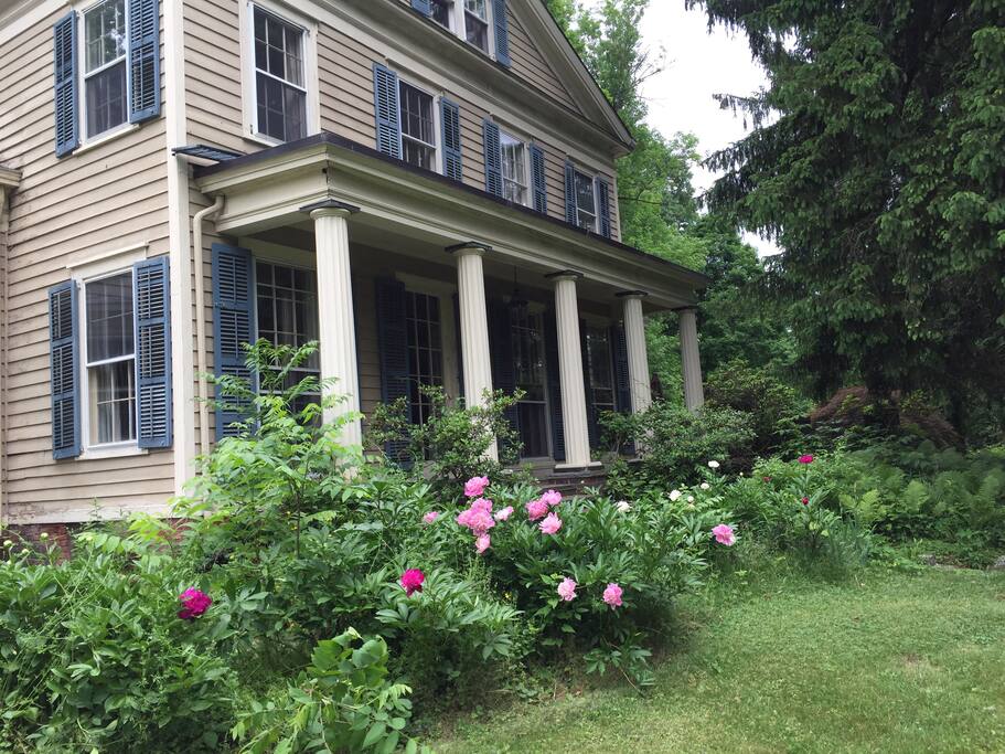 Flowers and trees surrounding the house