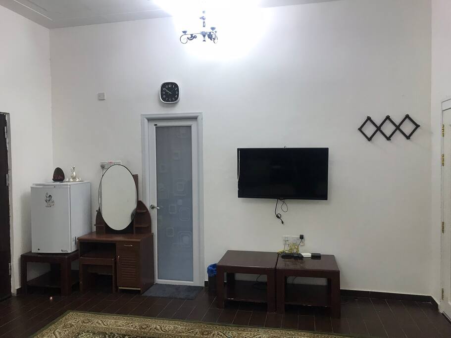 Private entrance from outdoors, fridge, bathroom, and TV