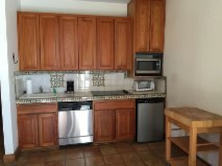 Dishwasher, microwave, toaster oven and wine fridge.
