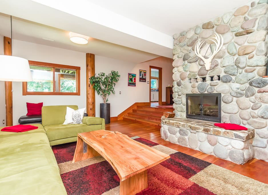 Large living area with River Rock gas fireplace