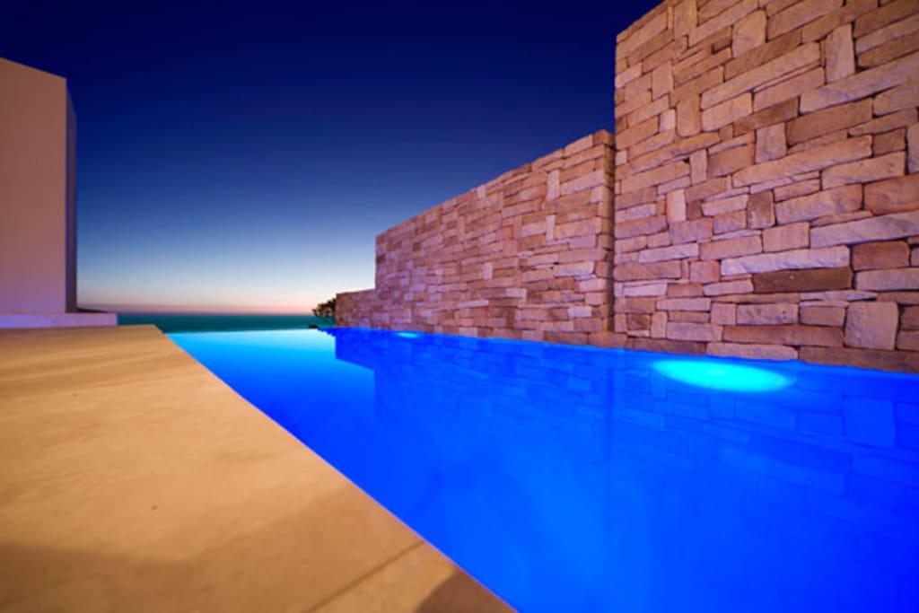 Sparkling blue pool with sea views