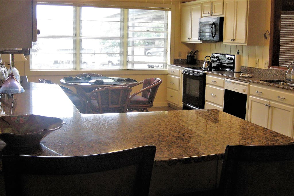 Kitchen with large window for natural light and lake view