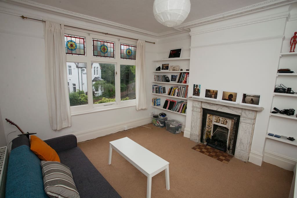 This is my sitting room/ dining room as you can see I have nice stained glass windows and original Victorain features