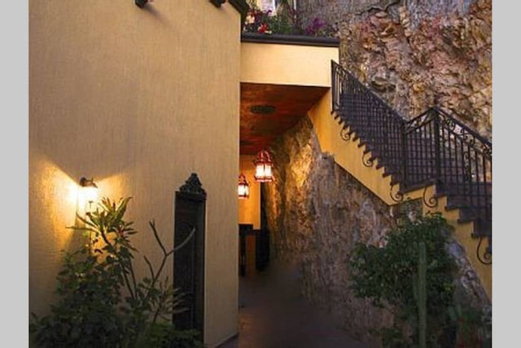 Entry patio with fountain and natural rock walls welcomes you to Casa Amistad