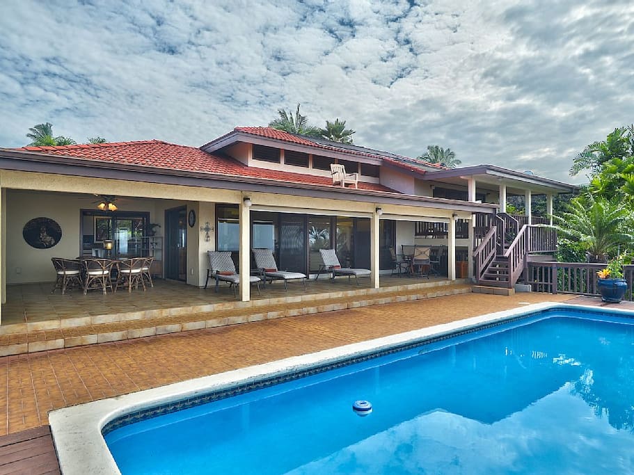 Back of the house with solar heated pool.