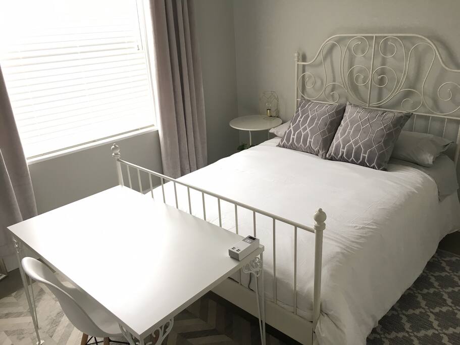 Bedroom 1: Double bed, desk, closet and private bathroom with shower.