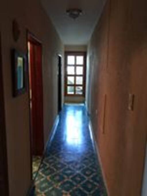 Hallway leading to back yard With palapa