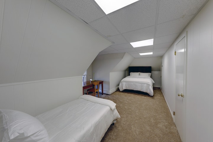 Upstairs bedroom with one queen and one twin bed