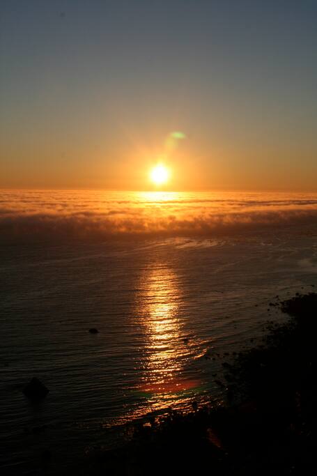 A sunset settling into the clouds