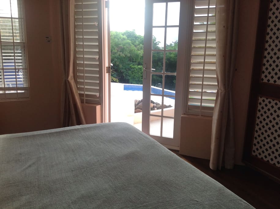 En suite master bedroom leading to pool. Have a dip before breakfast.