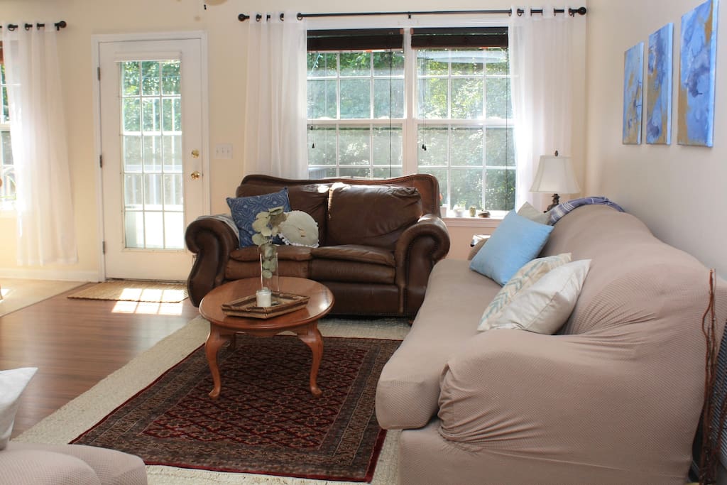 West facing windows in living room provide beautiful afternoon sun and lovely sunset views!