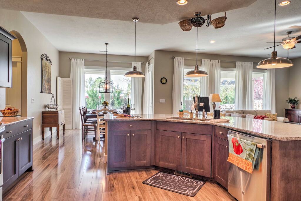 This open-floor plan is filled with charming decor - highlighted by the natural light that pours through the large windows.