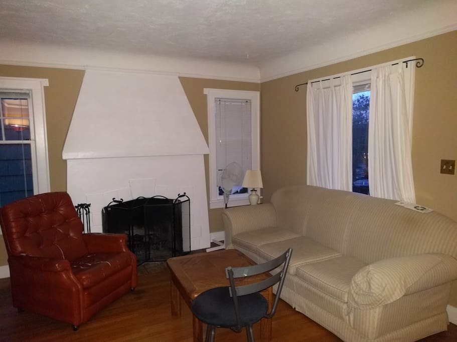 Another couch and table along with a (working) fireplace.