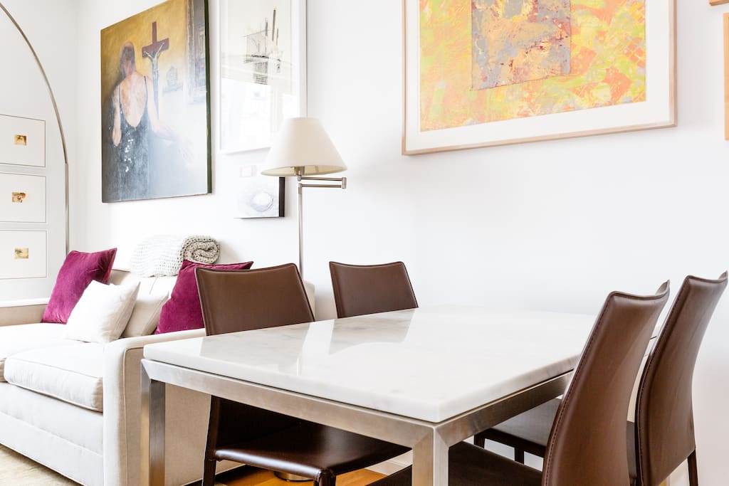 Dining Area: Marble table and four comfortable leather chairs.