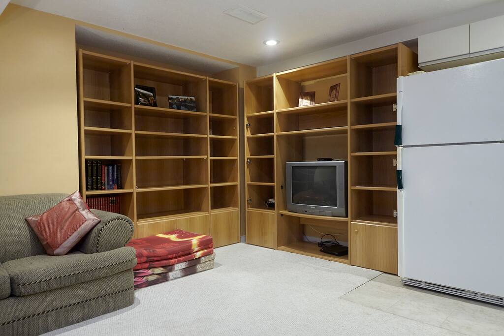 Spacious living room with TV