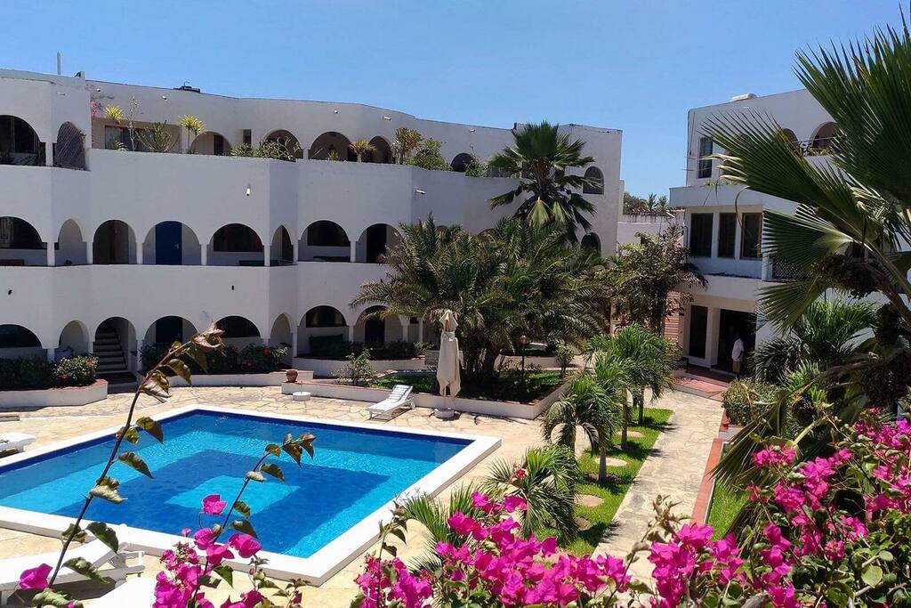 Charming Penthouse , the building , garden and swimming pool