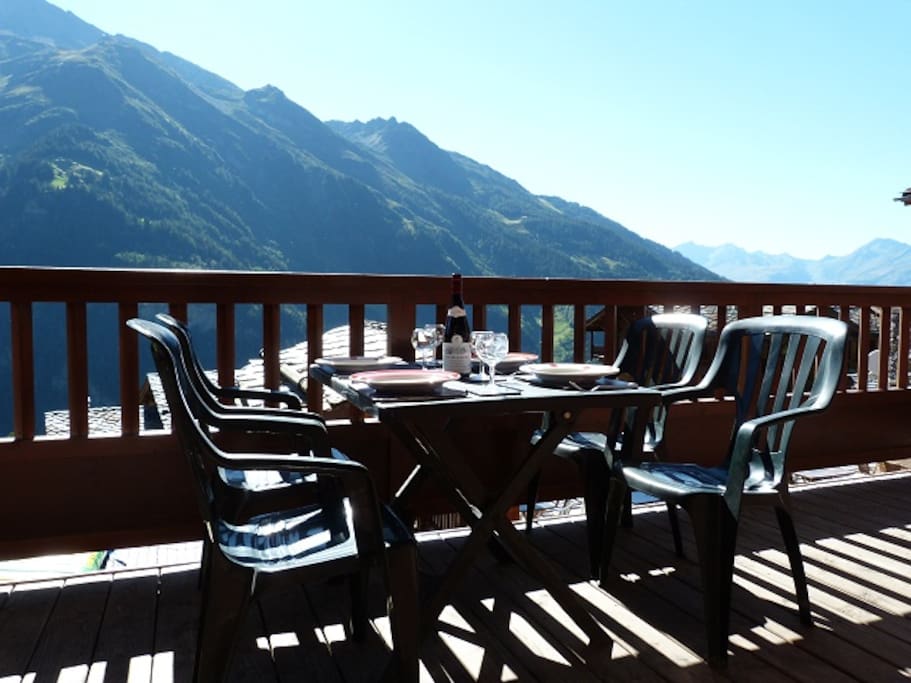 The sunny balcony has stunning mountain views