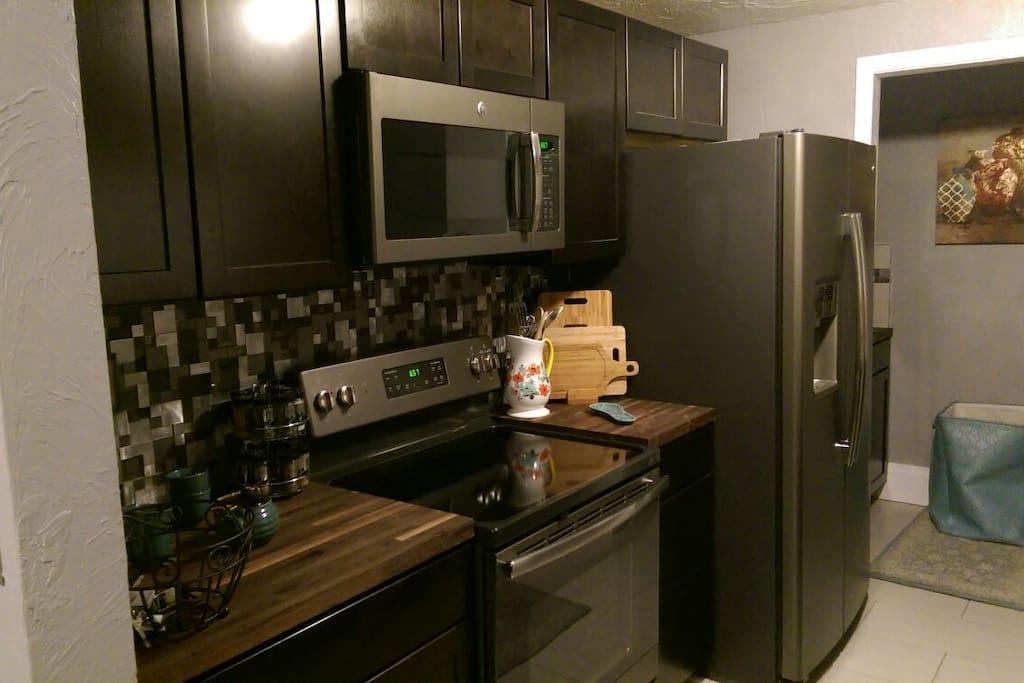 Beautiful fully equipped kitchen with solid oak, and granite countertops.