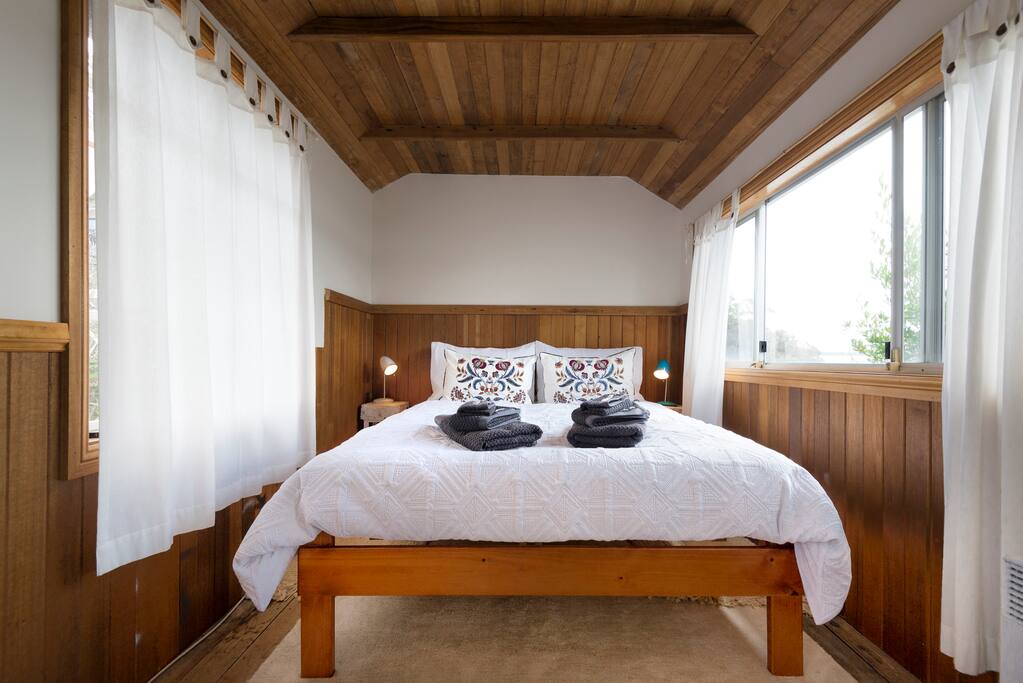 Comfortable double bed, window on Left to garden, on Right to water view, might even see some dolphins from your bed!