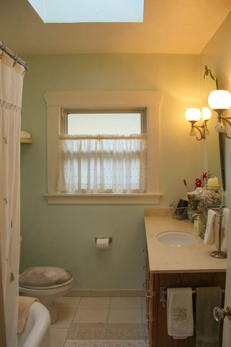 Private bathroom with shower and tub.