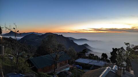 A rustic wooden cabin with a picturesque view
