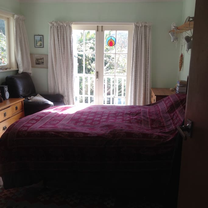 Lovely sunny room with French doors to verandah.