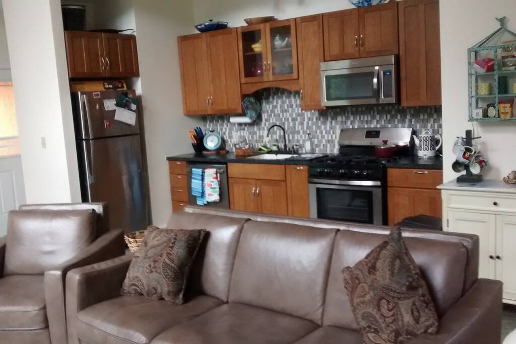 sitting area in open space shared with kitchen and dining area