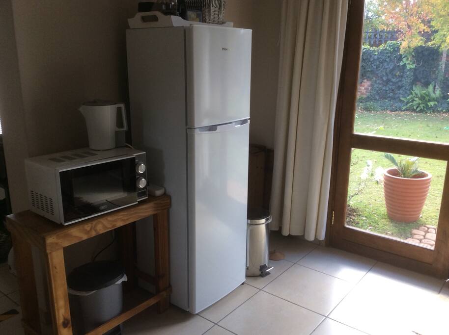 Fridge, microwave and kettle.
